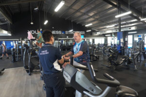 Exercise Physiologist Leon supporting a diabetes client during low-impact cardio.